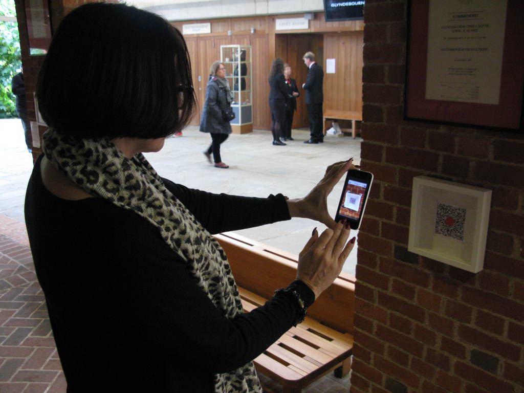 You Are Here: Liisamaija Hautsalo, musicologist and researcher from the Sibelius Academy, accessing a QR code