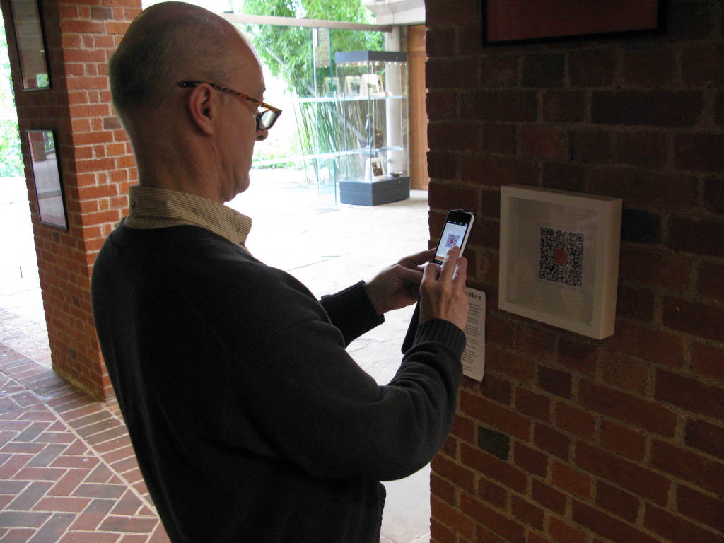 You Are Here: Nick Till, Professor of Opera & Music Theatre/Director of the University of Sussex Centre for Research in Opera and Music Theatre, accessing a QR code at Glyndebourne.