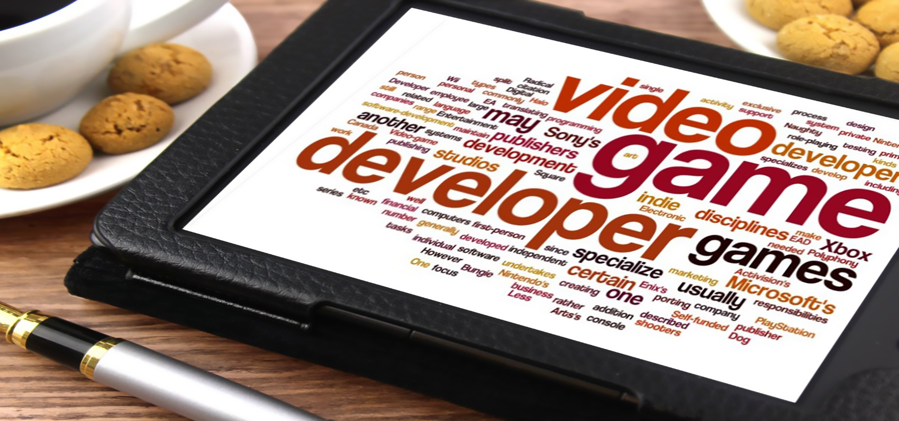 Image: Tablet with a wordcloud with terms related to video games: video games, developer, games, Xbox, Microsoft, Sony's, publishers, developments, studios. Links to Student Competition blog.