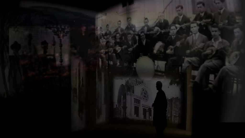 Images of pre-war Jewish life projected onto the inside walls of Block 27 at Auschwitz I. A digital collage by the author.