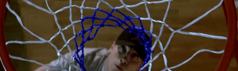 a man seen from above and through a basket ball net